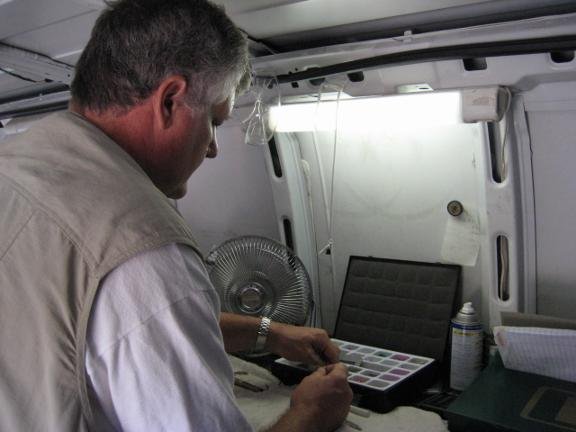 Locksmith working inside van