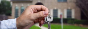 Man hand holding on finger keys to new house