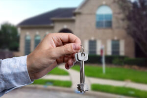 Man hand holding on finger keys to new house