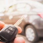 Man unlocking car with his backup set of car keys