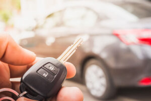Man unlocking car with his backup set of car keys