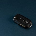 Car keys with fob on a blue background