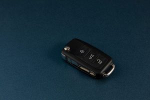 Car keys with fob on a blue background