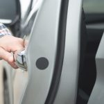 Locksmith opening door after getting unlocked for a customer.