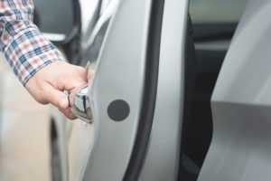 Locksmith opening door after getting unlocked for a customer.